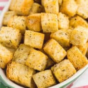A white bowl of air fryer croutons.