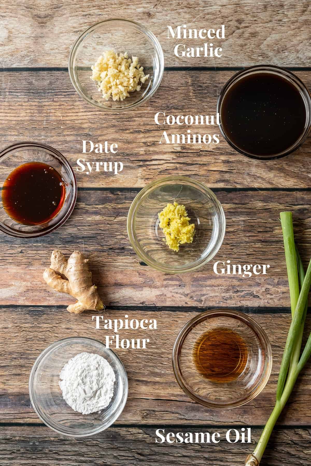 An overview photo of the ingredients needed for beef and broccoli stir fry sauce on a wood background.