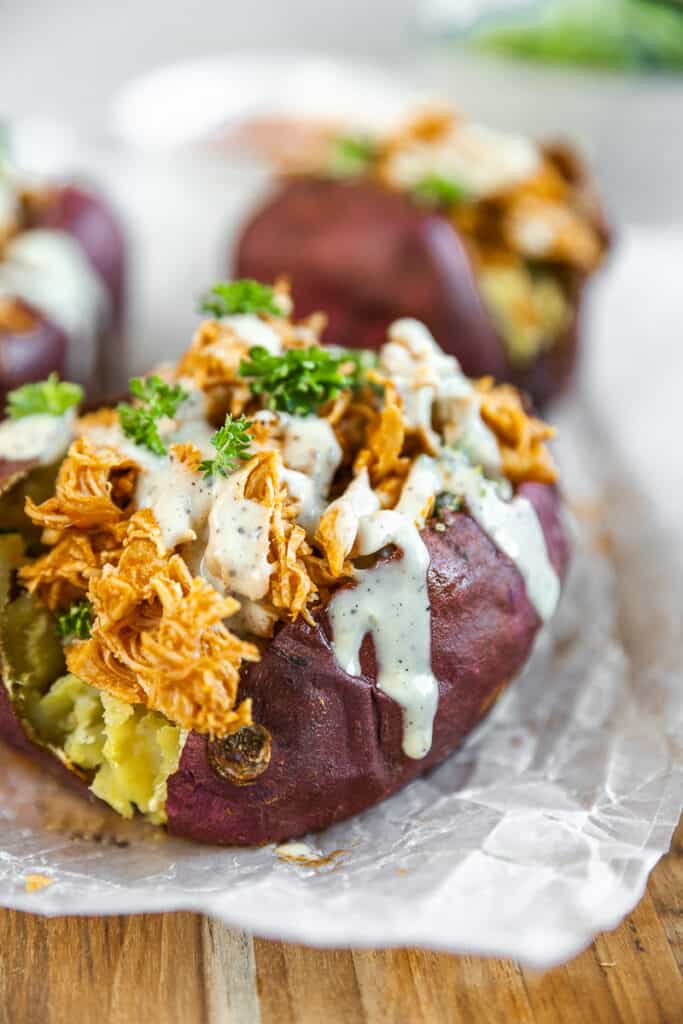An overview shot of a baked sweet potato stuffed with buffalo ranch chicken