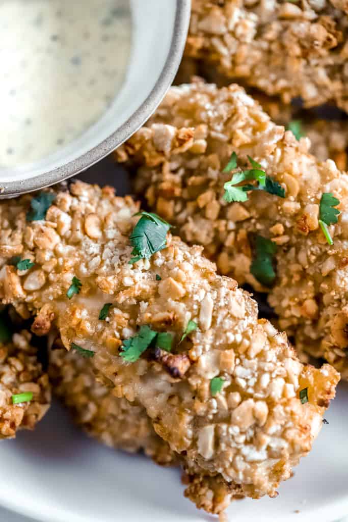 A closeup of cashew crusted chicken tenders 