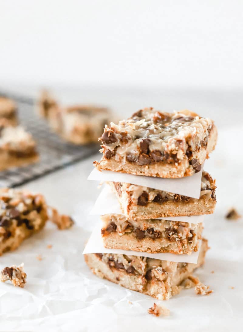 A stack of paleo magic cookie bars