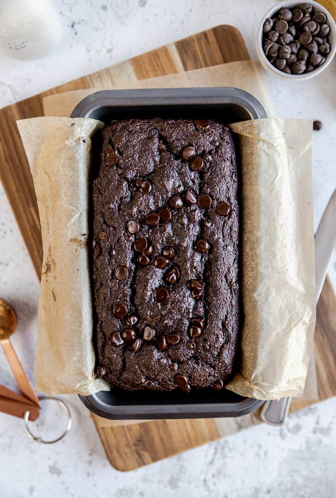 An overview of a loaf of chocolate chip banana bread in the pan