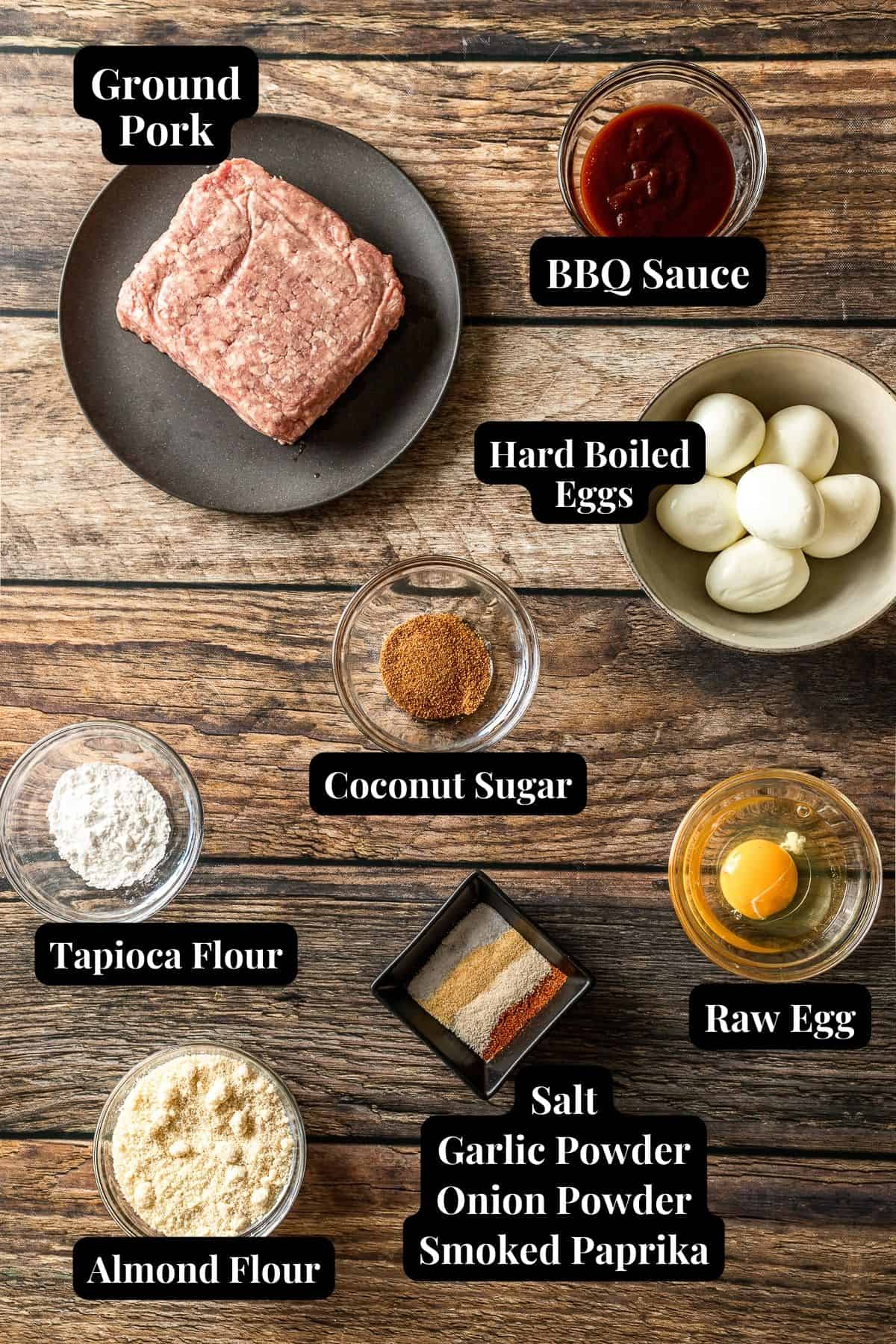 An overview shot of the ingredients needed for healthy scotch eggs on a wood background.
