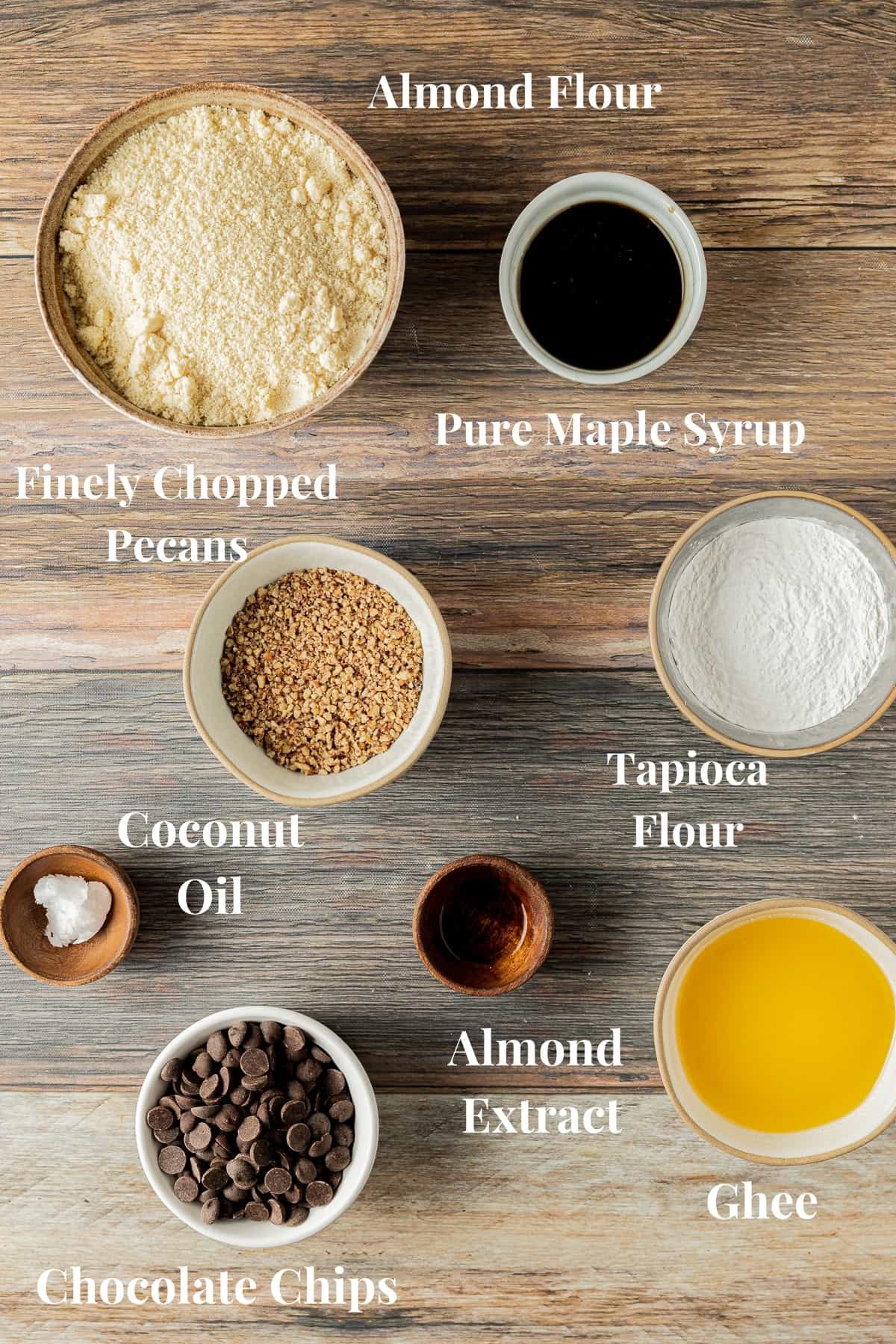 An overview shot of the ingredients needed for paleo shortbread cookies on a wood background.