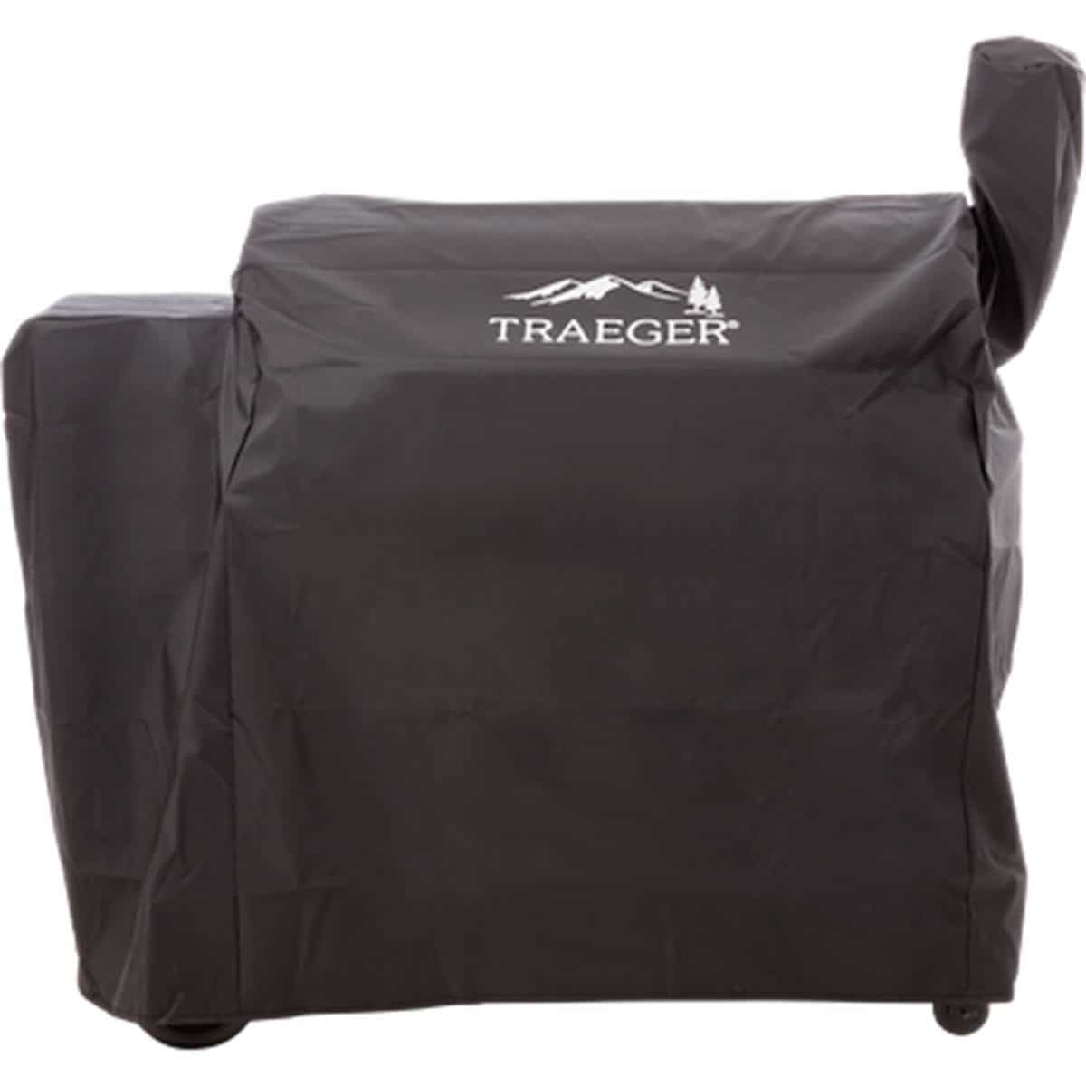 A black traeger grill cover covering a traeger smoker on a white background.