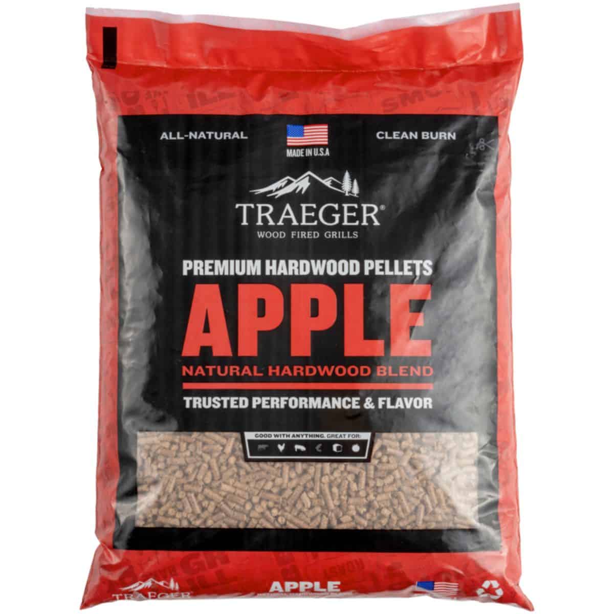 A red bag of apple traeger wood pellets on a white background.