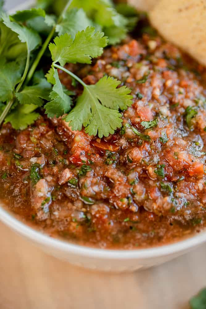 A close up shot of a bowl of Whole30 salsa topped with cilantro