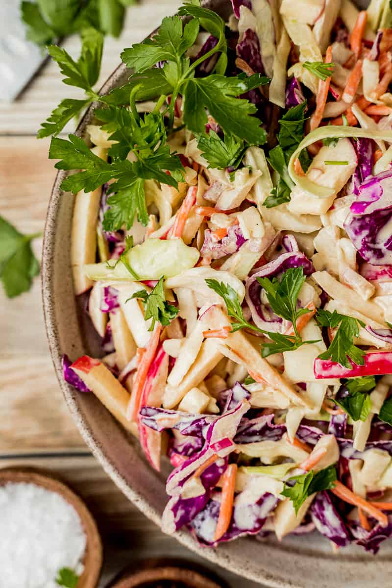 A closeup overview shot of a bowl of Whole30 coleslaw topped with parsley